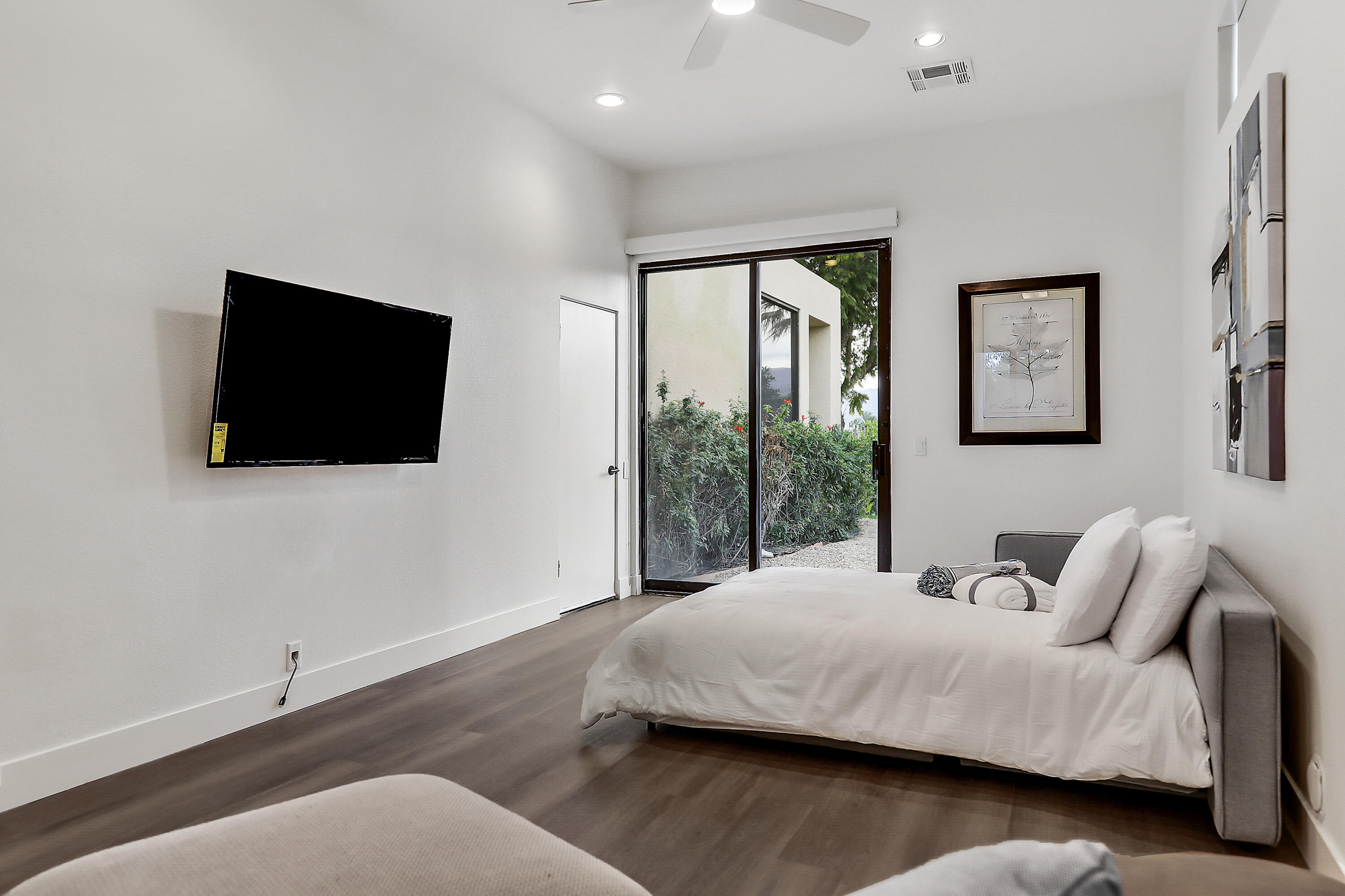 71000 Los Altos Court Rancho Mirage, CA 92270 - Photo 36 of 46 a bedroom with a bed tv and window