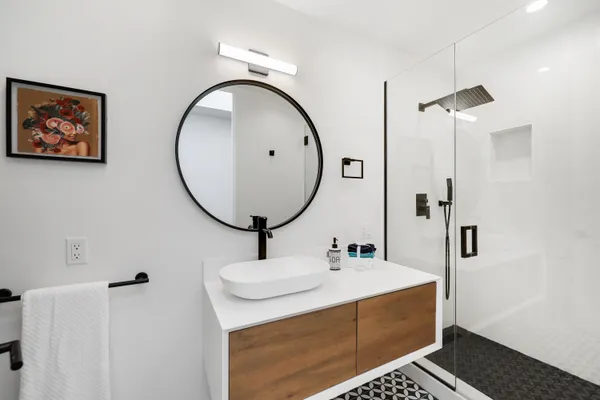 a bathroom with a sink and a mirror