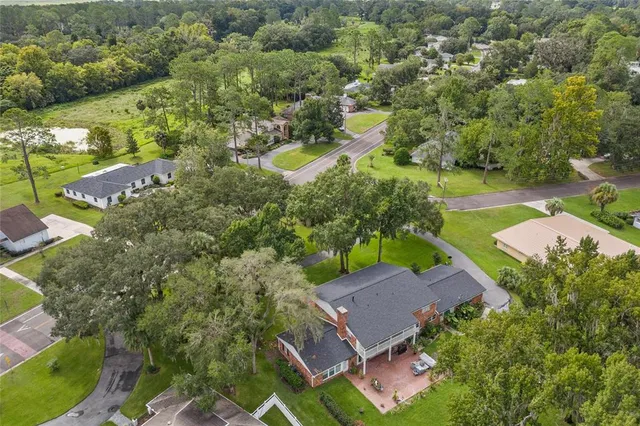 an aerial view of a house with a garden