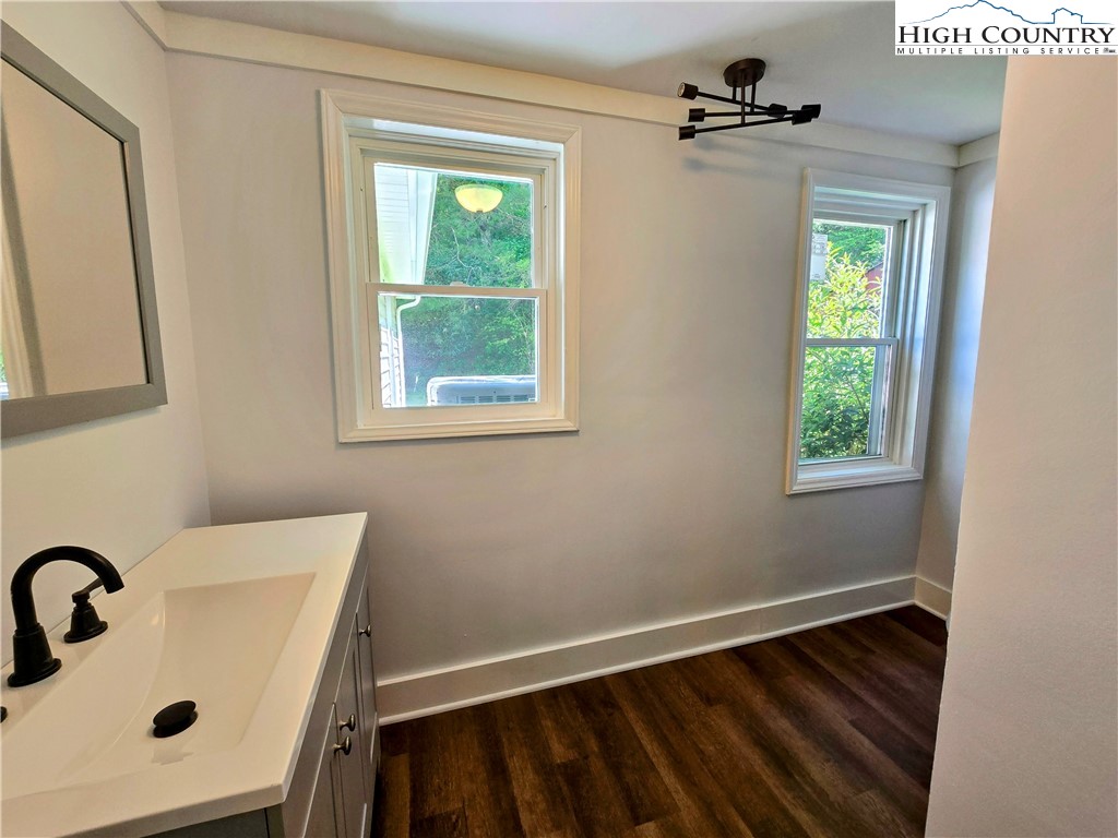 1207 Meat Camp Road Boone, NC 28607 - Photo 15 of 24 a bathroom with a sink and a window