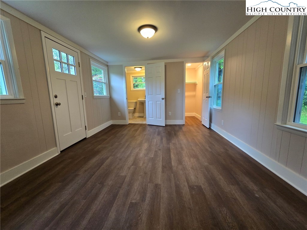 1207 Meat Camp Road Boone, NC 28607 - Photo 16 of 24 a view of an empty room with wooden floor and a window