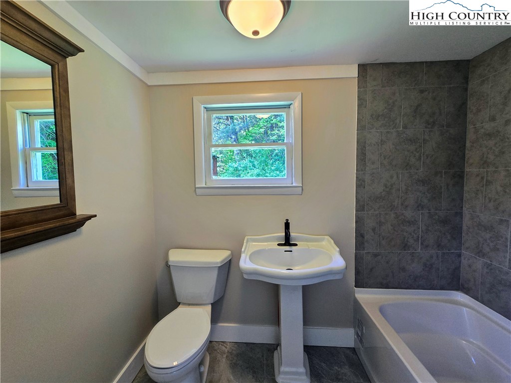 1207 Meat Camp Road Boone, NC 28607 - Photo 17 of 24 a bathroom with a sink toilet and tub