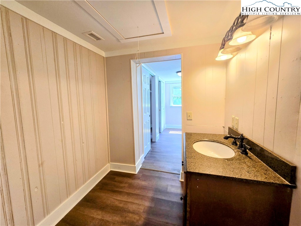 1207 Meat Camp Road Boone, NC 28607 - Photo 18 of 24 a bathroom with a granite countertop sink and a mirror