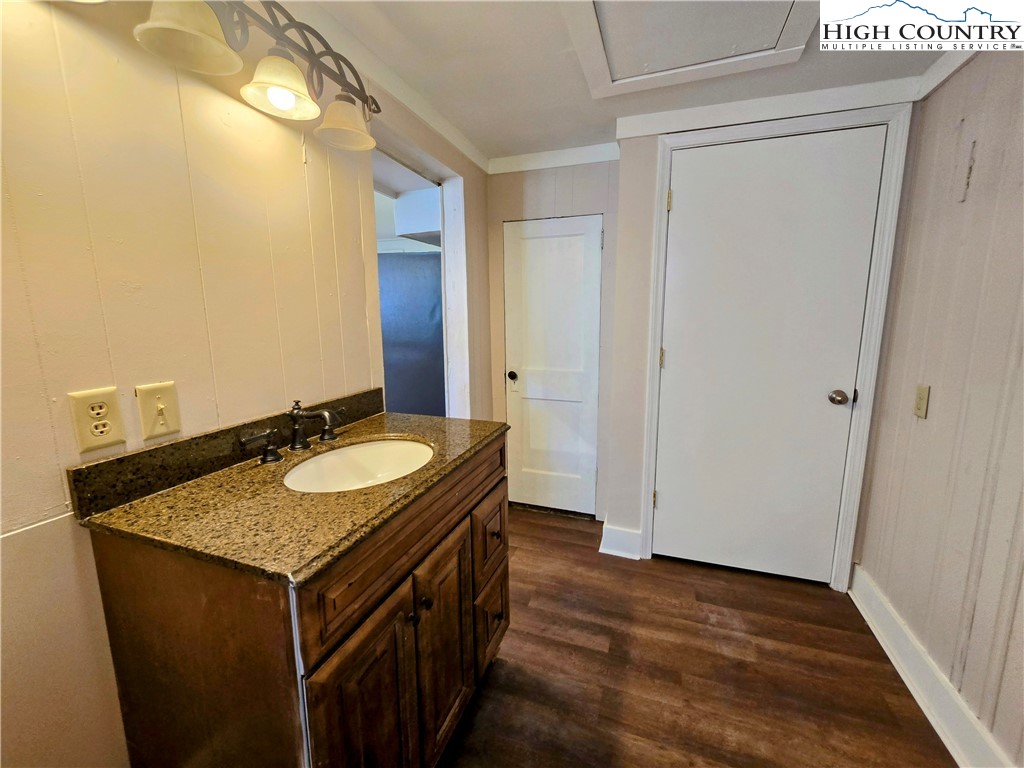1207 Meat Camp Road Boone, NC 28607 - Photo 20 of 24 a bathroom with a granite countertop sink and a mirror