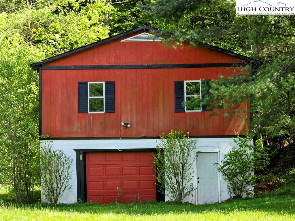 1207 Meat Camp Road Boone, NC 28607 - Photo 23 of 24 a front view of a house with a yard