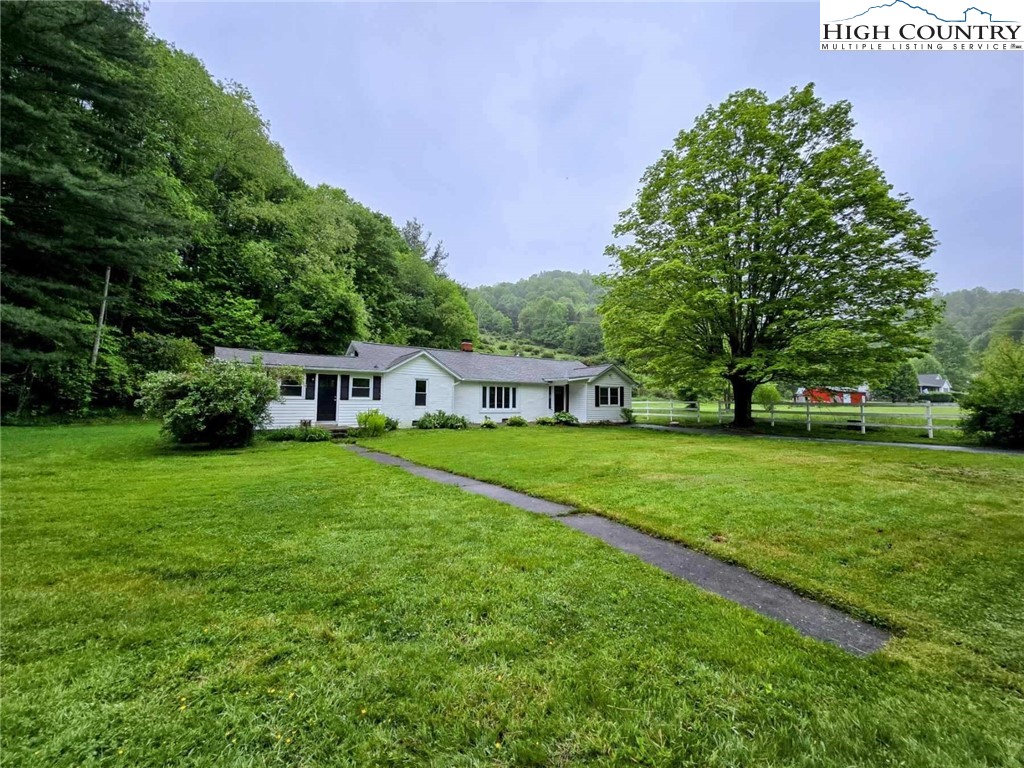1207 Meat Camp Road Boone, NC 28607 - Photo 3 of 24 a front view of a house with garden