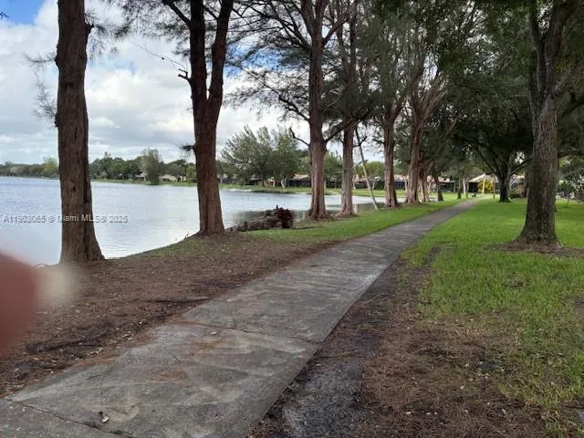 a view of a lake next to a road
