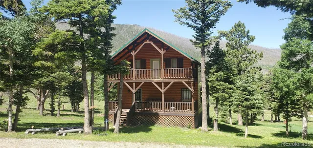 a view of a backyard with table and chairs