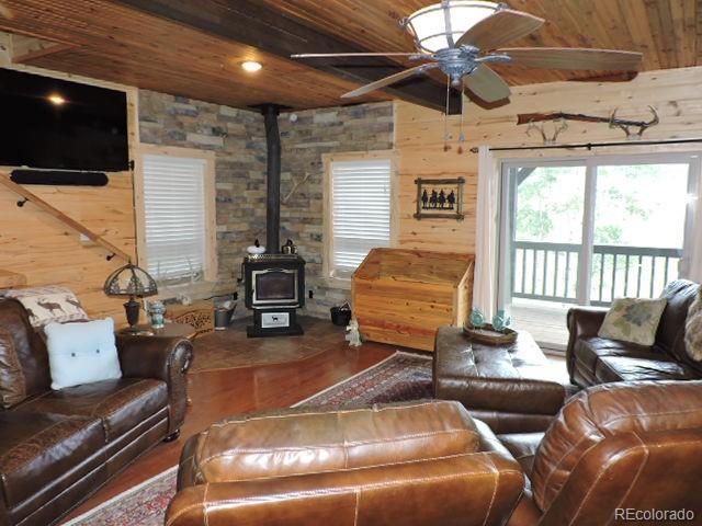 2137 Riccardo Lane Fort Garland, CO 81133 - Photo 18 of 50 a living room with furniture and a flat screen tv
