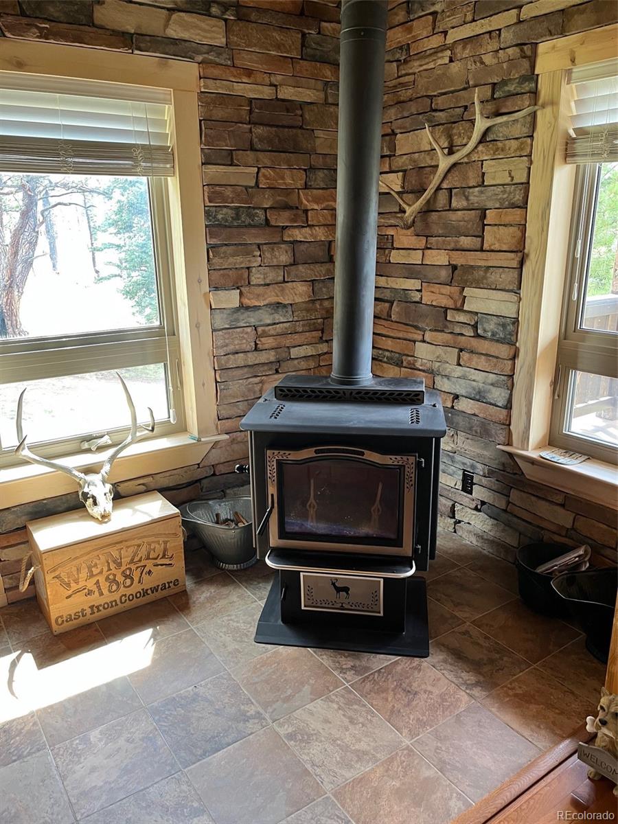 2137 Riccardo Lane Fort Garland, CO 81133 - Photo 20 of 50 a living room with furniture and a fireplace