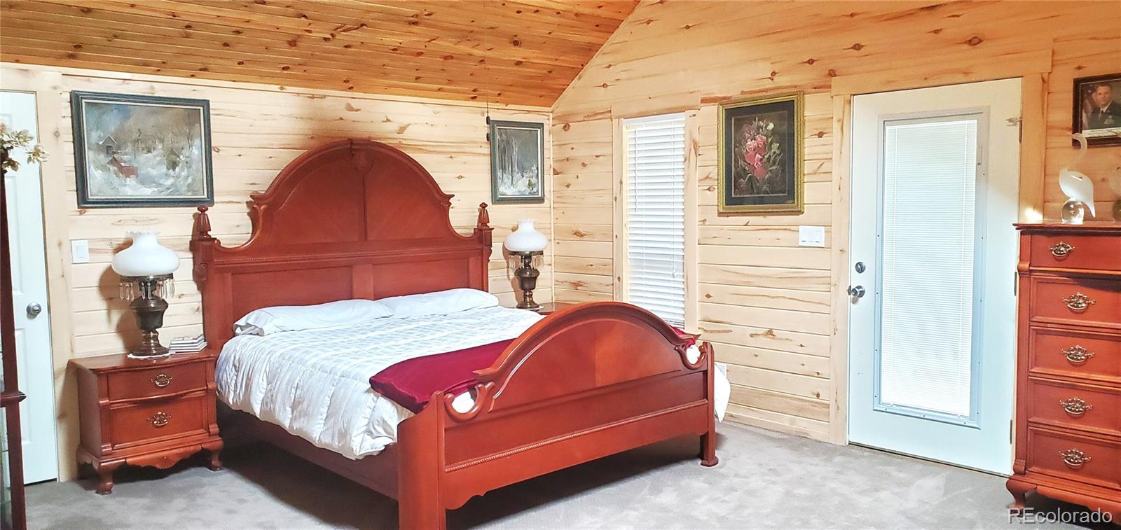 2137 Riccardo Lane Fort Garland, CO 81133 - Photo 27 of 50 a bedroom with a bed and a dresser