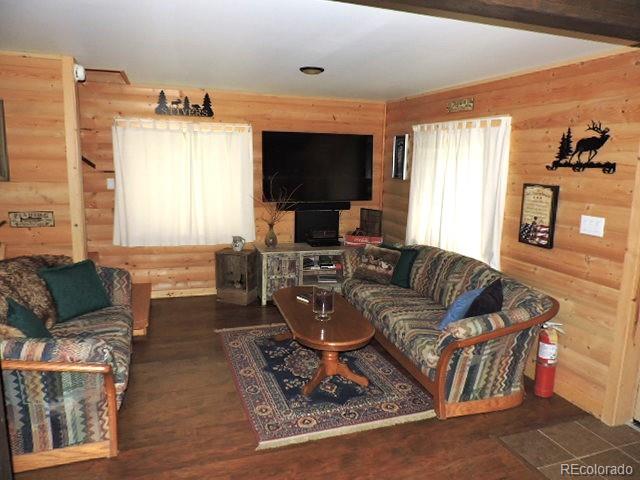 2137 Riccardo Lane Fort Garland, CO 81133 - Photo 31 of 50 a living room with furniture and a flat screen tv