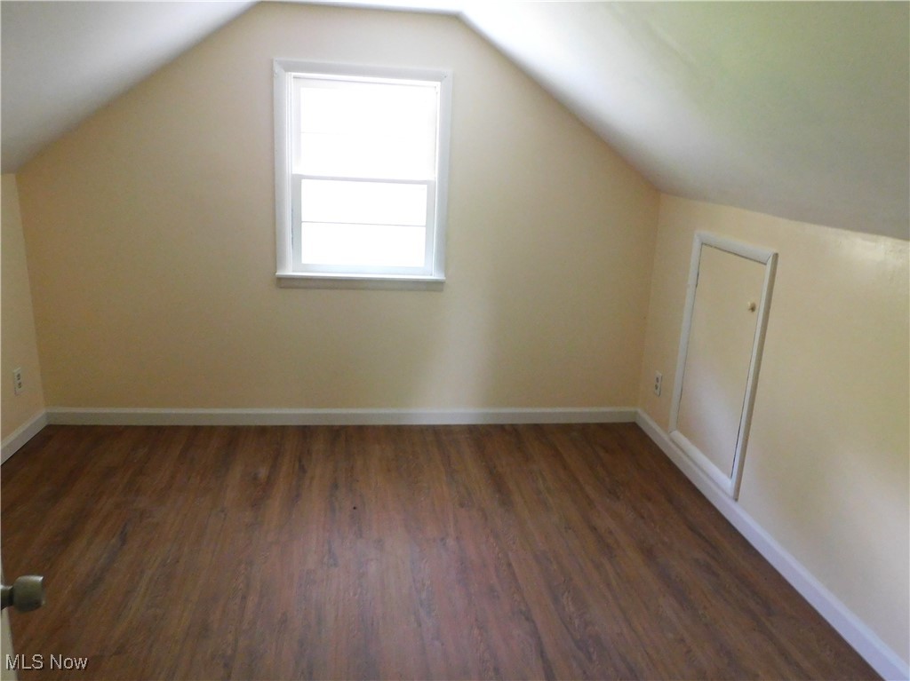 339 Johnson Plank Road Warren, OH 44481 - Photo 24 of 29 BR 3 B up featuring dark wood-style floors, vaulted ceiling, and baseboards