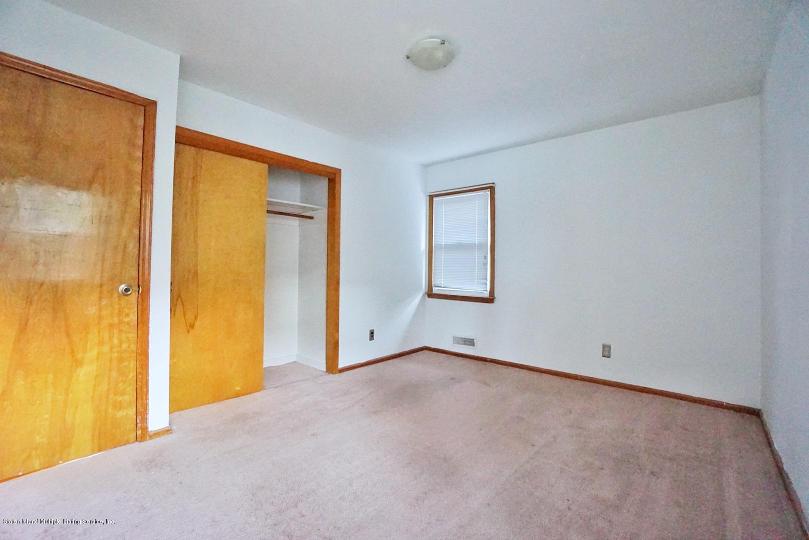 1099 Richmond Road Staten Island, NY 10304 - Photo 16 of 28 a view of an empty room with a window
