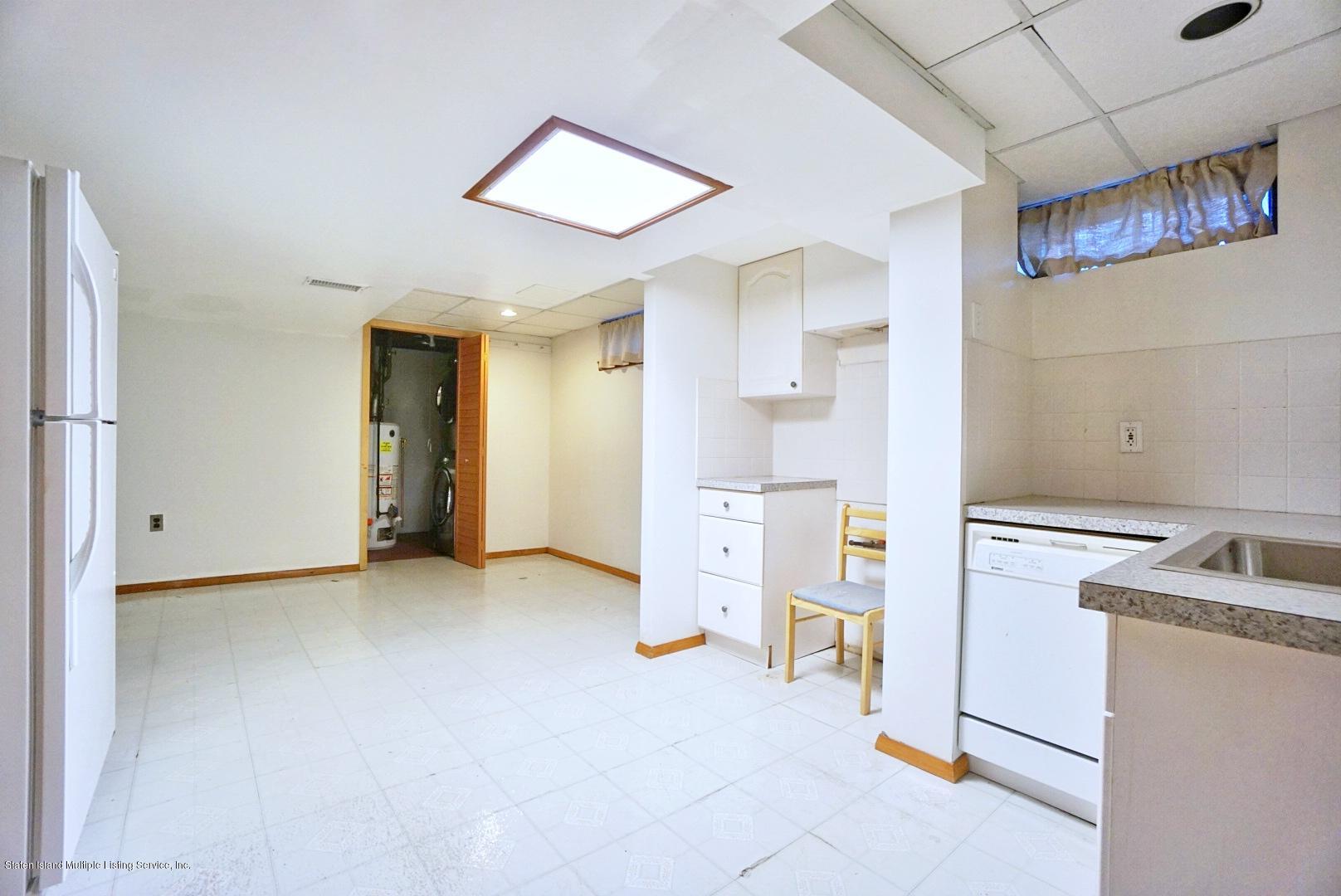 1099 Richmond Road Staten Island, NY 10304 - Photo 19 of 28 a view of a kitchen with refrigerator and car parked