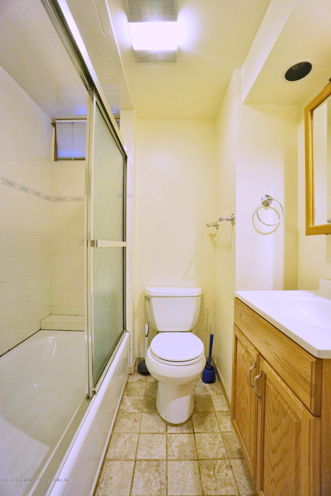 1099 Richmond Road Staten Island, NY 10304 - Photo 20 of 28 a bathroom with a sink toilet and shower