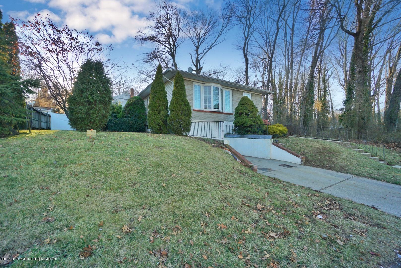 1099 Richmond Road Staten Island, NY 10304 - Photo 2 of 28 a view of a house with a yard