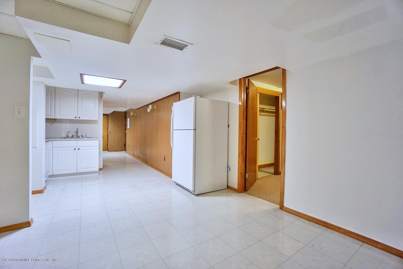 1099 Richmond Road Staten Island, NY 10304 - Photo 21 of 28 a view of a kitchen with refrigerator and cabinet