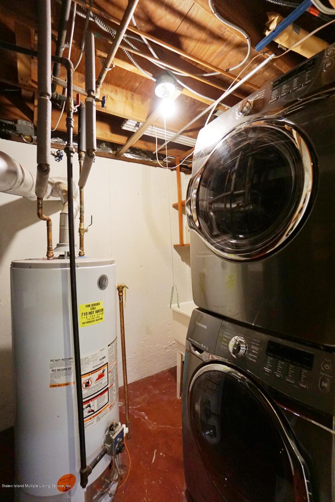 1099 Richmond Road Staten Island, NY 10304 - Photo 24 of 28 a utility room with dryer and washer