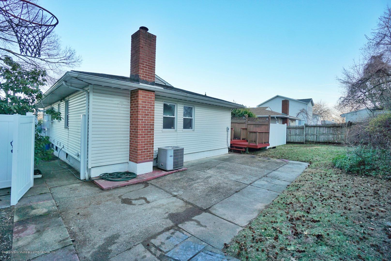 1099 Richmond Road Staten Island, NY 10304 - Photo 25 of 28 a front view of a house with garden