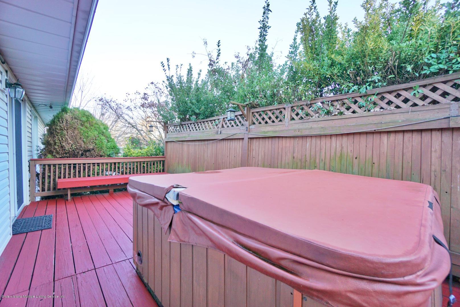 1099 Richmond Road Staten Island, NY 10304 - Photo 27 of 28 a balcony with wooden floor