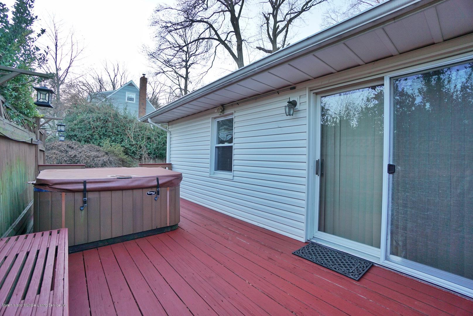 1099 Richmond Road Staten Island, NY 10304 - Photo 28 of 28 a backyard of a house with wooden floor