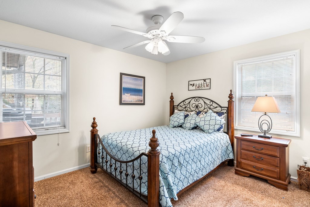 251 Rivers Edge Drive Hayesville, NC 28904 - Photo 21 of 45 a bedroom with a bed and a table