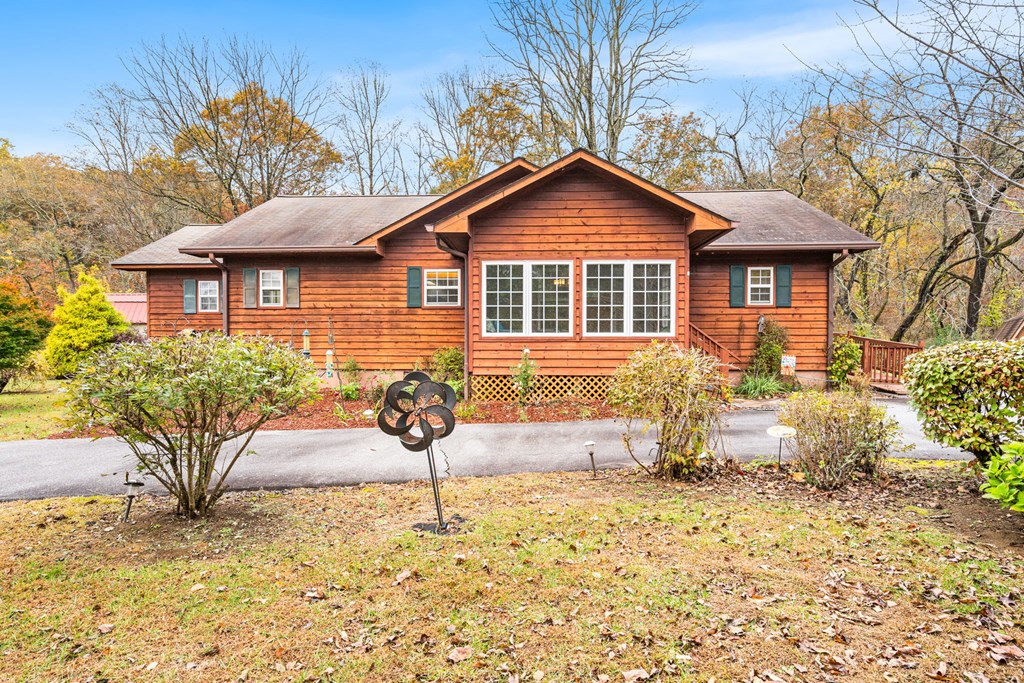 251 Rivers Edge Drive Hayesville, NC 28904 - Photo 35 of 45 a front view of a house with a yard