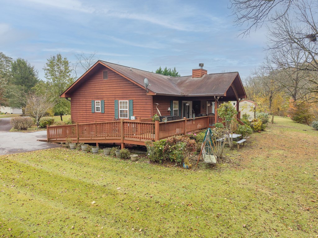 251 Rivers Edge Drive Hayesville, NC 28904 - Photo 41 of 45 a view of a house with a yard and sitting area