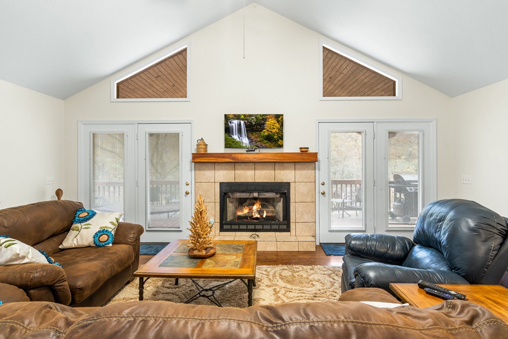 251 Rivers Edge Drive Hayesville, NC 28904 - Photo 10 of 45 a living room with furniture and a fireplace