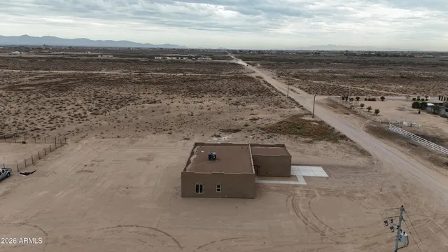 a bathroom with double vanity and a mirror