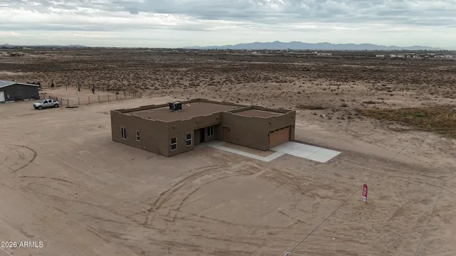 a en suite bathroom with double sink and a mirror