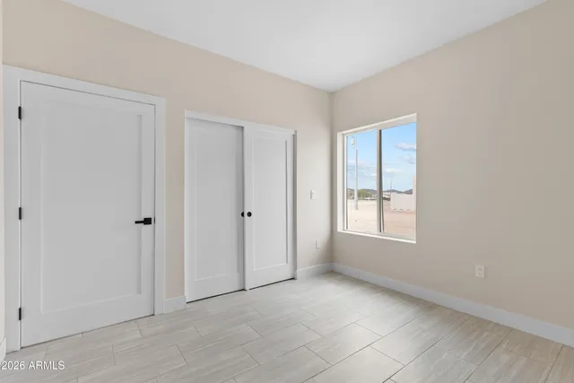 a picture of a bathroom with a shower and a window