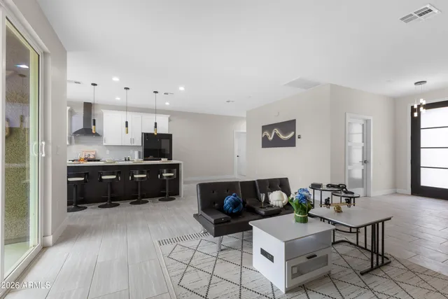 a view of kitchen with sink and wooden floor