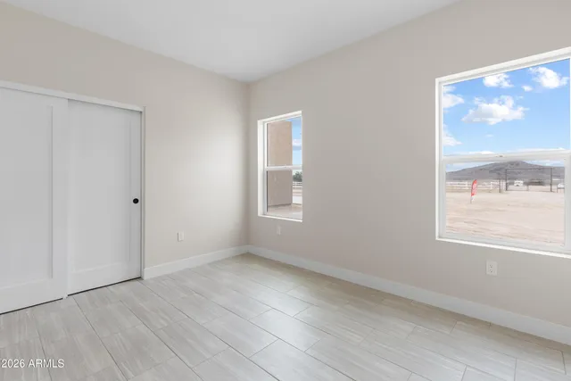 a view of a livingroom with furniture and a flat screen tv
