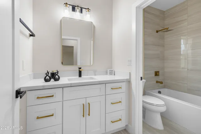 a kitchen with a stove a sink and a refrigerator