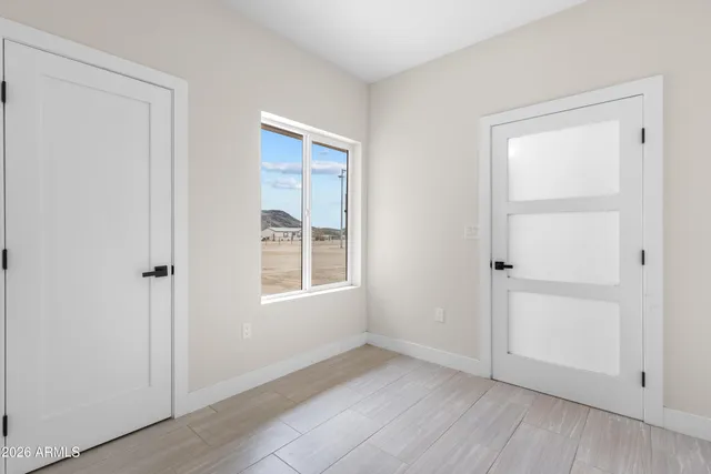 a kitchen with a stove a sink a refrigerator and cabinets
