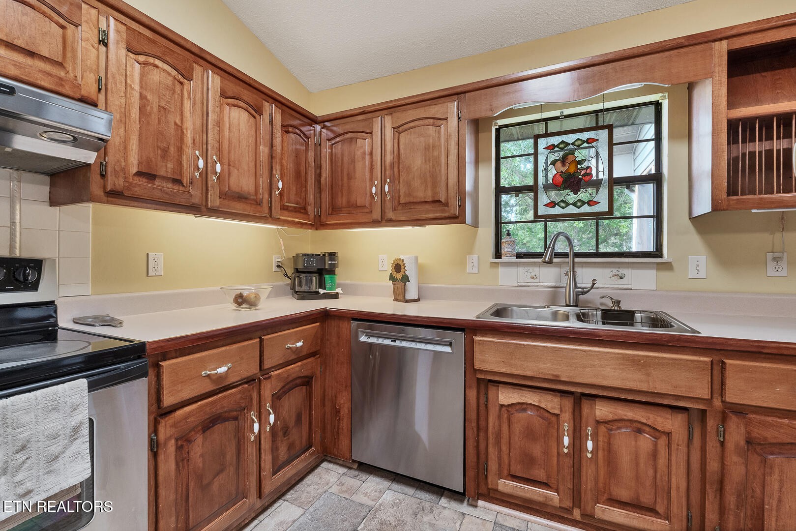 449 Foss Road Maryville, TN 37801 - Photo 22 of 49 a kitchen with stainless steel appliances granite countertop a sink stove and cabinets