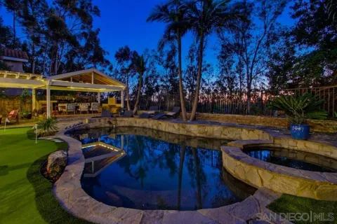 a view of a swimming pool with a patio