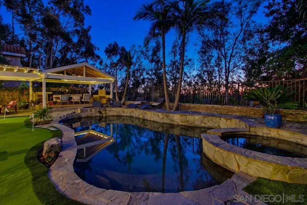a view of a swimming pool with a patio