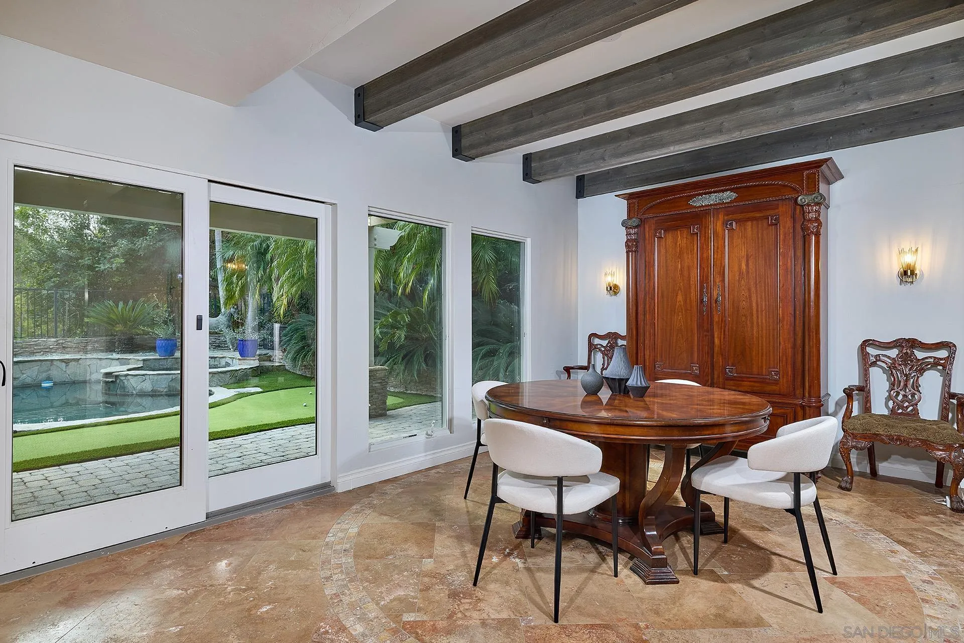 10616 Falcon Rim Point San Diego, CA 92131 - Photo 13 of 44 a dining room with furniture and wooden floor