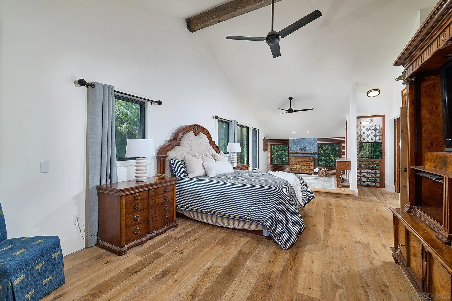 10616 Falcon Rim Point San Diego, CA 92131 - Photo 21 of 44 a bedroom with a bed window and a television