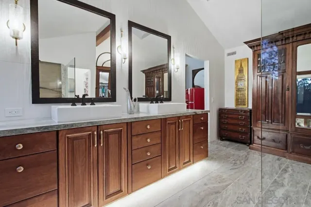 a view of house with swimming pool and sitting area