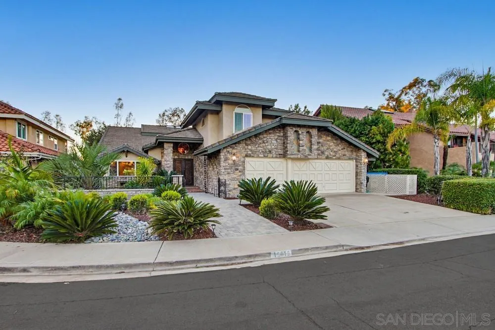 10616 Falcon Rim Point San Diego, CA 92131 - Photo 3 of 44 a front view of house with a garden
