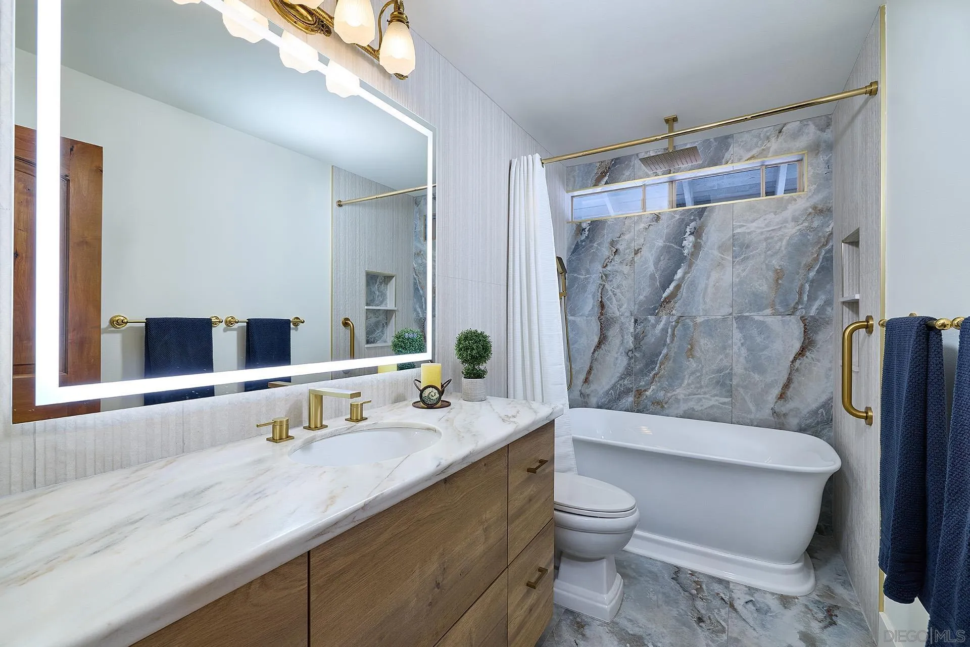 10616 Falcon Rim Point San Diego, CA 92131 - Photo 31 of 44 a bathroom with a granite countertop sink toilet and shower