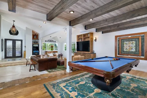 a kitchen with stainless steel appliances granite countertop a stove a sink dishwasher and a dining table with garden view