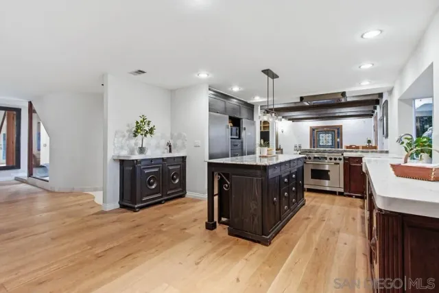 a bathroom with a toilet a sink and a mirror