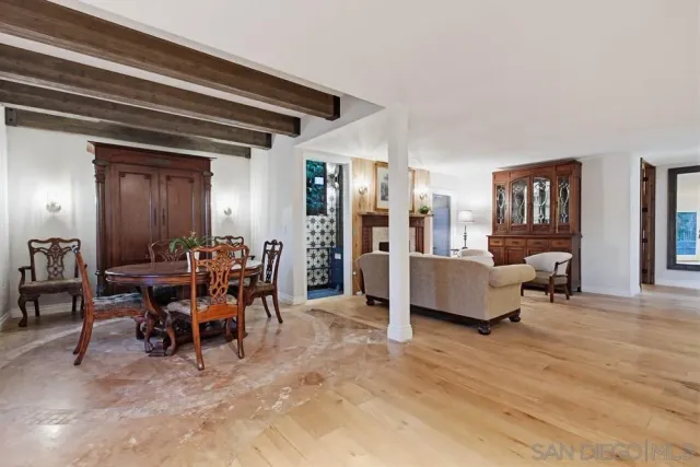a view of hallway with livingroom and furniture