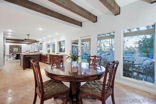 a bedroom with a bed a dresser and mirror