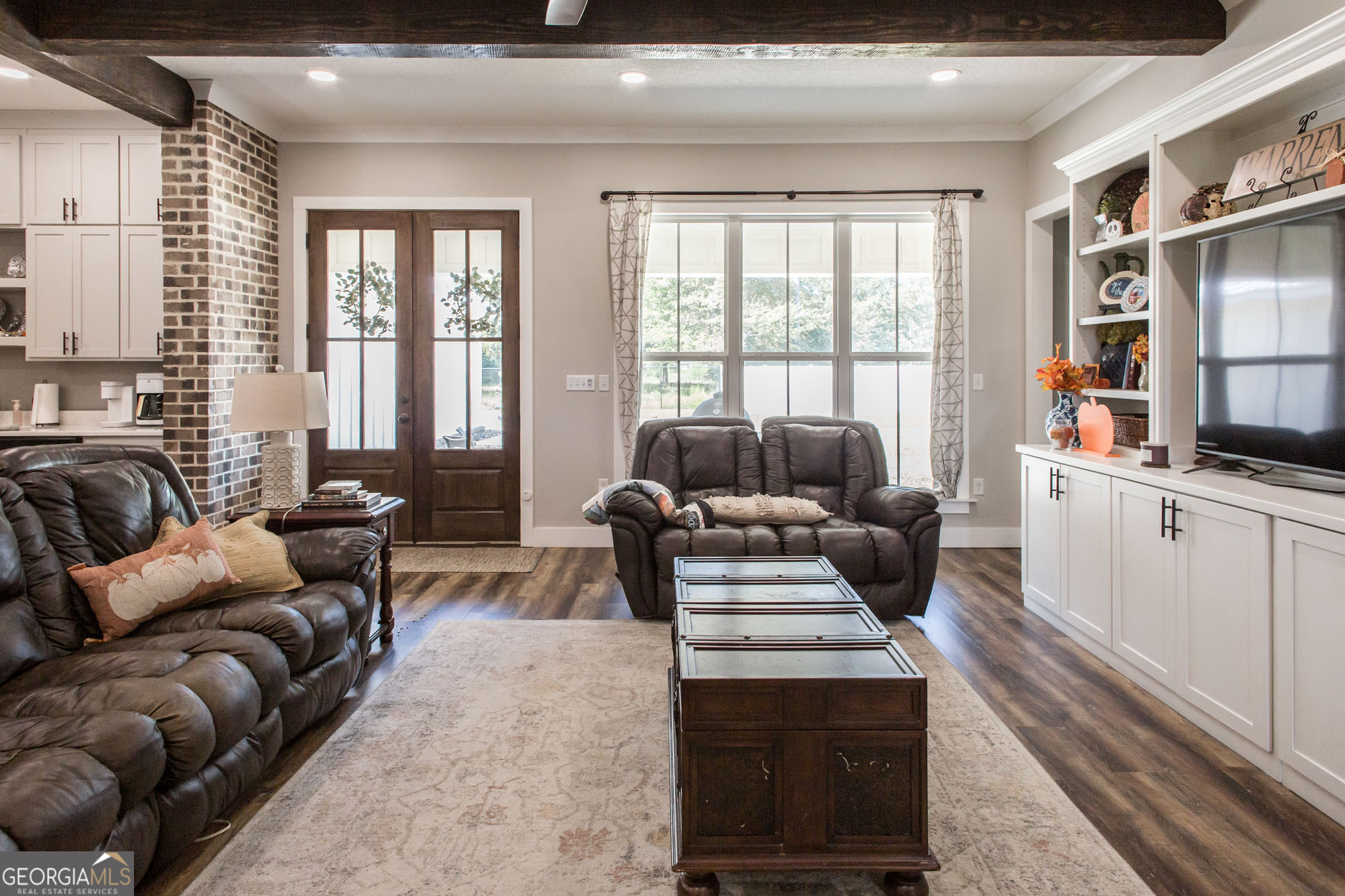 664 Saddle Circle Waycross, GA 31503 - Photo 13 of 39 a living room with furniture fireplace and flat screen tv